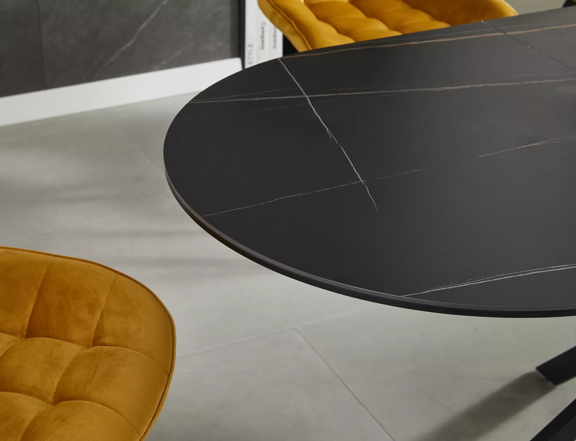 Matt black ceramic dining tabletop with fine grey and brown natural stone-effect veining