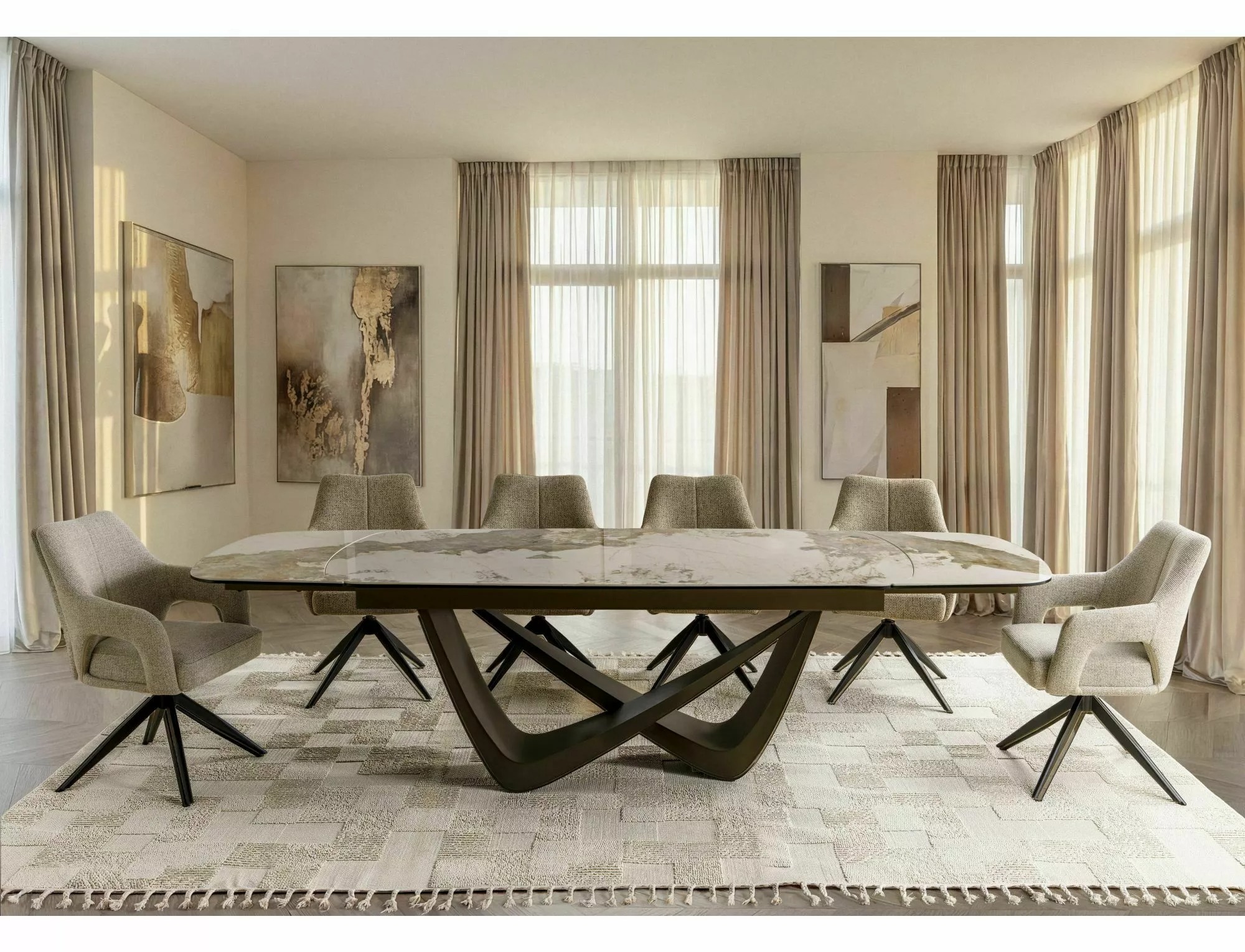 Maranello ceramic extending dining table with beige upholstered chairs in elegant modern dining room
