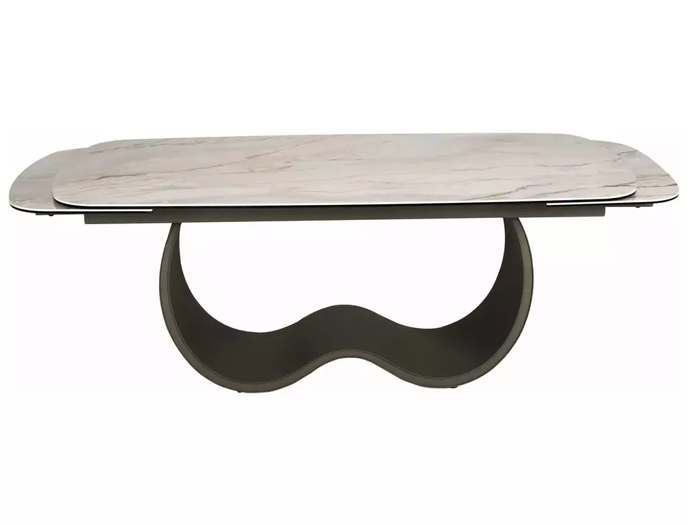 Side view of Casablanca extending dining table with curved metal base and beige ceramic top