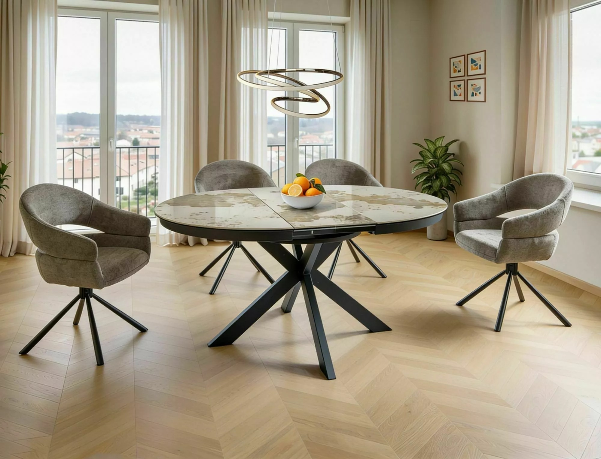 Porto round ceramic extending dining table with grey upholstered chairs in modern dining room